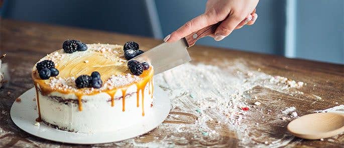 Cutting into a cake