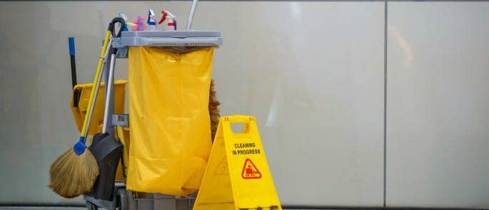 A clean up kit for cleaning spills and preventing slips, trips, and falls