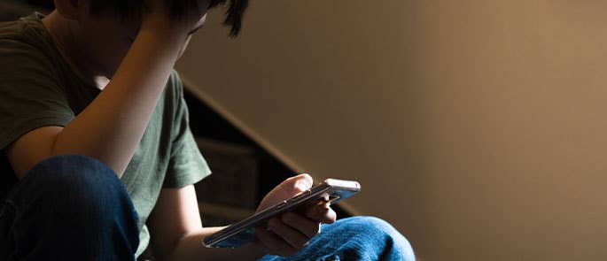 young child getting cyberbullied at home