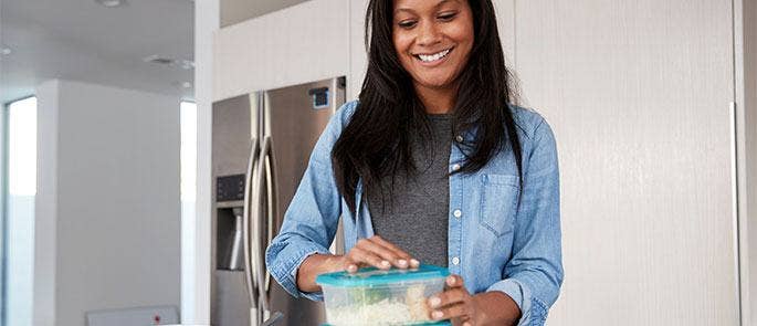 A woman organising her meal prep for the week