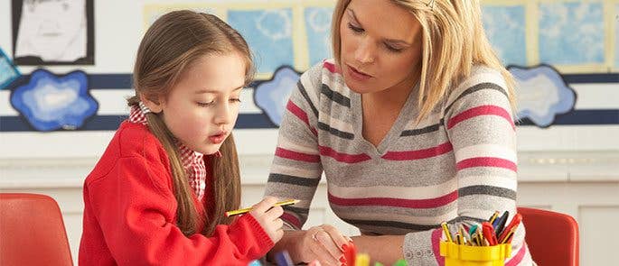A teacher and a child having a one to one