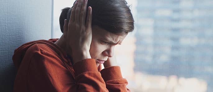 an adult experiencing sensory overload