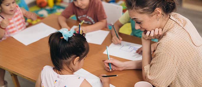 teaching assistant helping a student