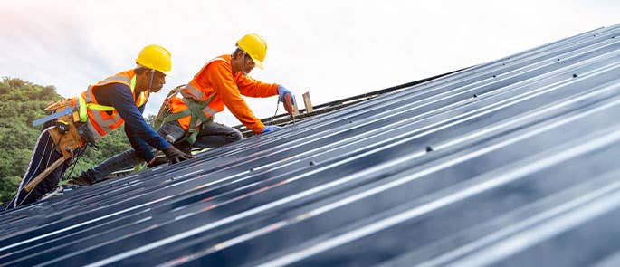 Employees working on a roof